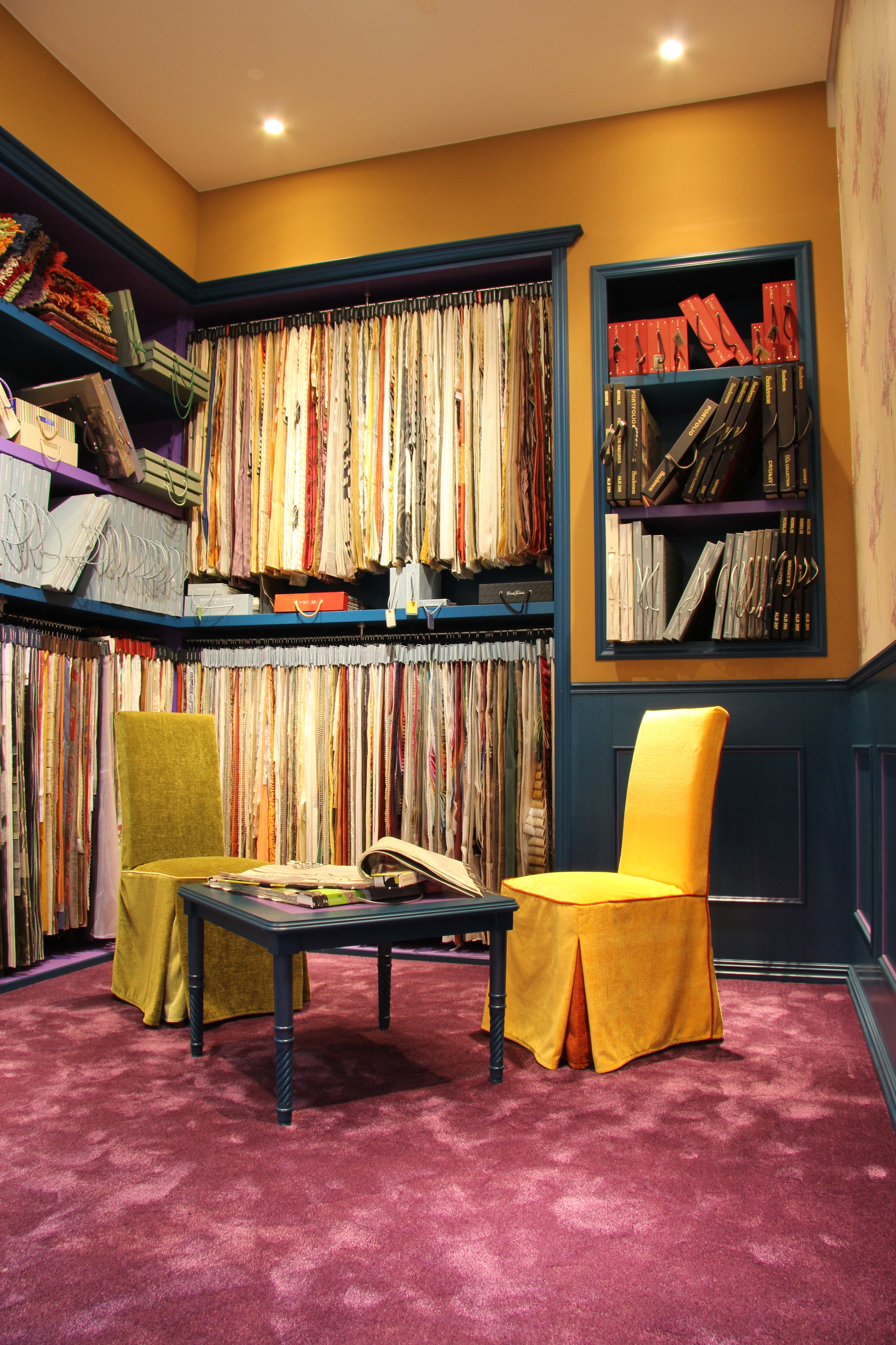 Detail view of the bespoke blue cabinetry and rich material textures