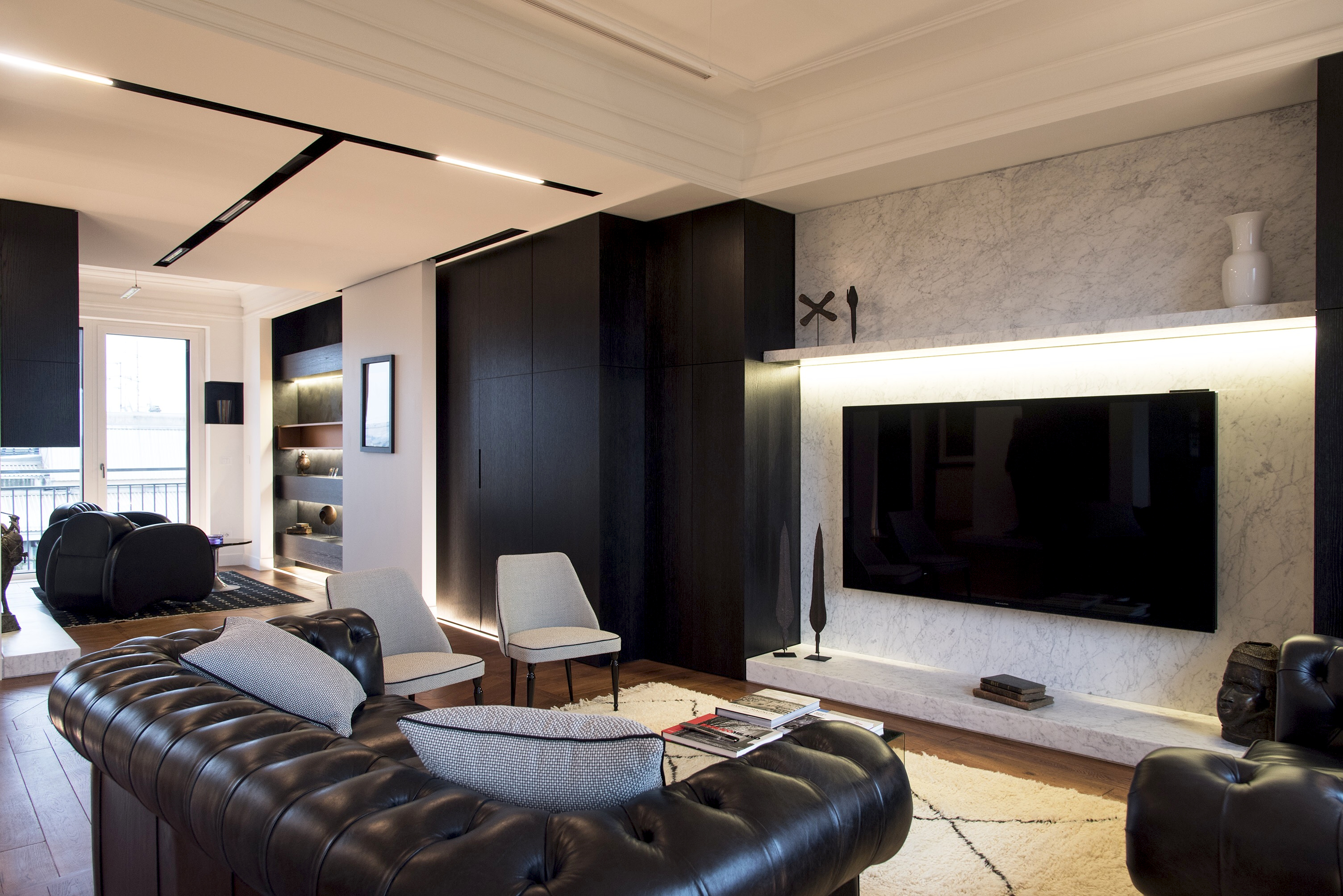 Interior view of the Milan top floor apartment emphasizing the use of black oak and natural light